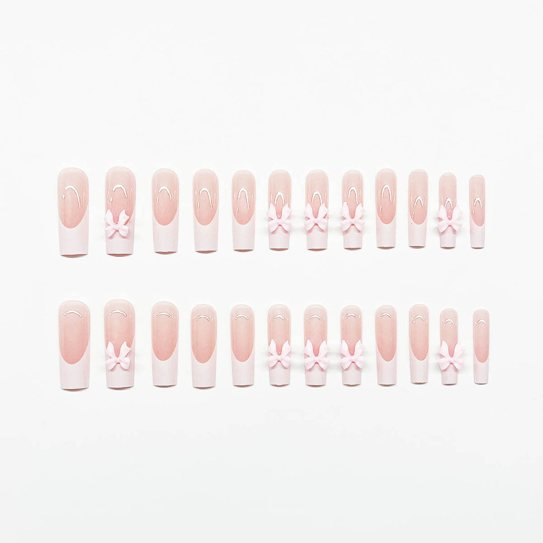 Artificial nails with playful bow design Kalsten