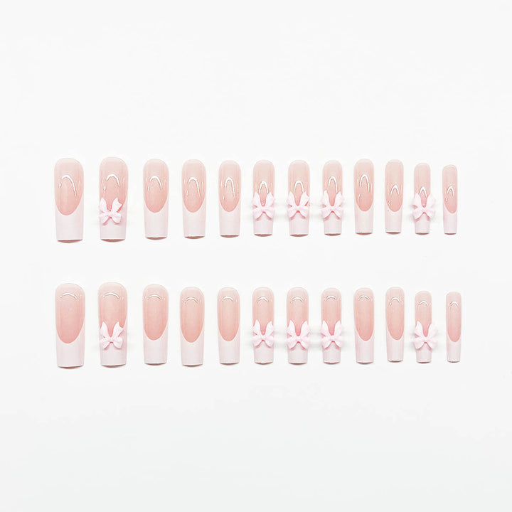 Artificial nails with playful bow design Kalsten
