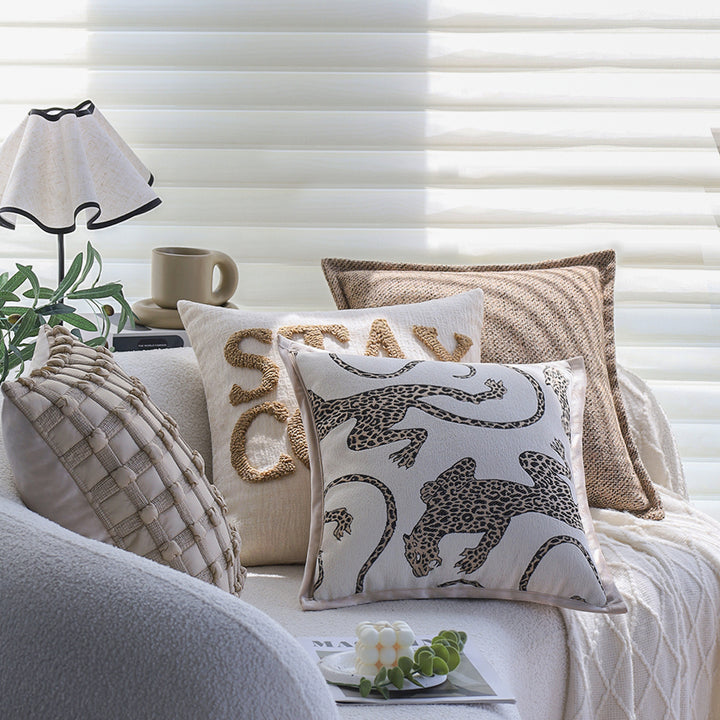 Square decorative cushion cover made of mottled bouclé weave with subtle piping Kalsten
