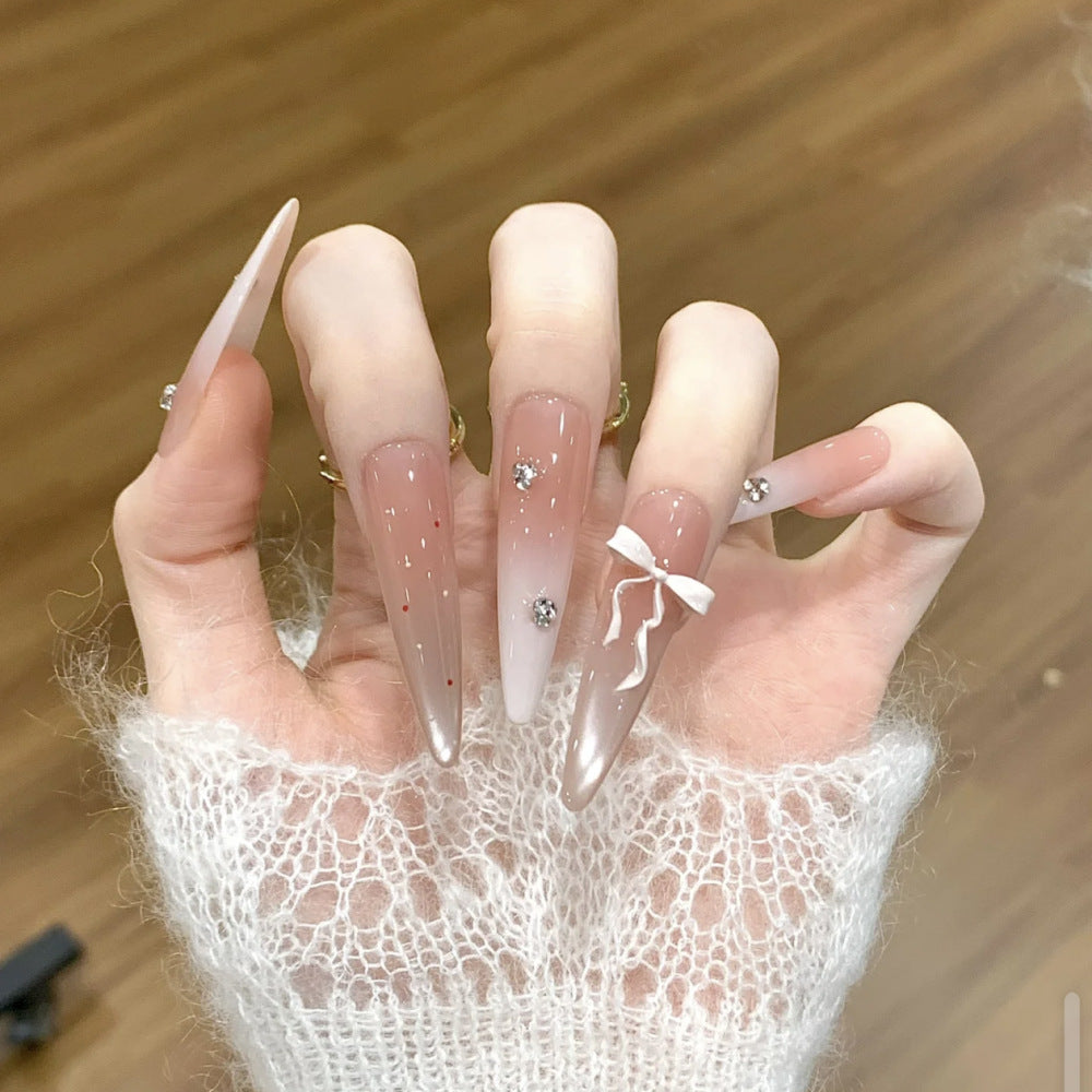 Artificial nails with elegant ombre design and delicate accents Kalsten