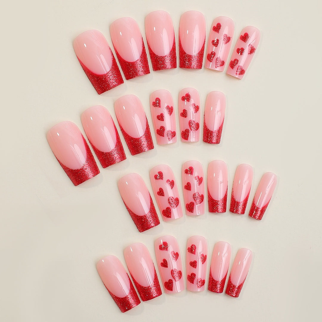 Artificial nail set with romantic heart designs and glitter accents Kalsten