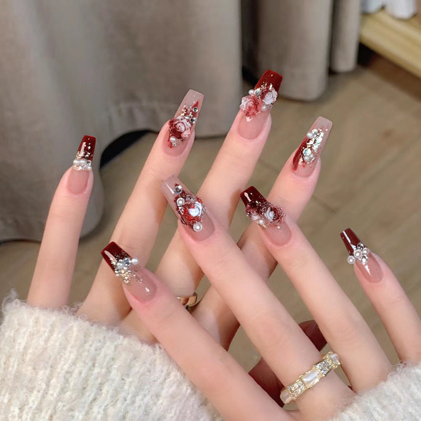 Glamorous artificial nails with delicate flower and glitter effects Kalsten