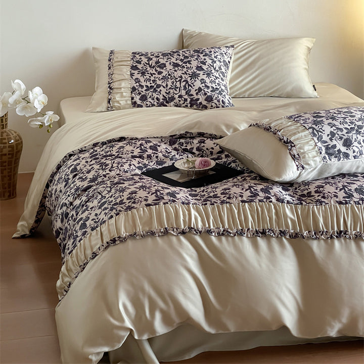 Extra soft satin duvet cover set with voluminous ruffle, subtle watercolor leaf print and concealed closure