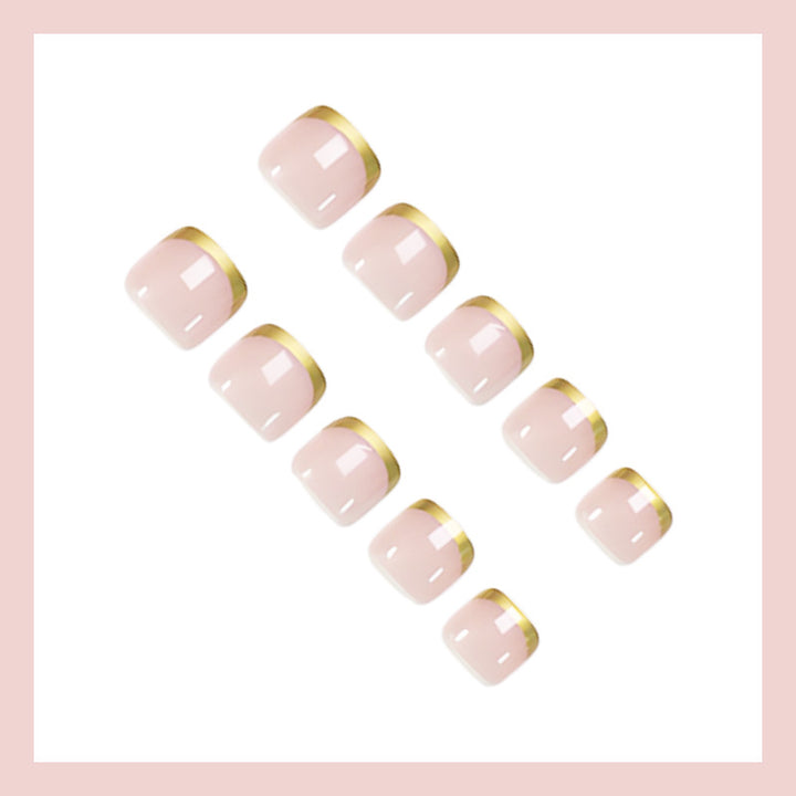 Toenail art set with elegant gold tips and delicate embellishments Kalsten