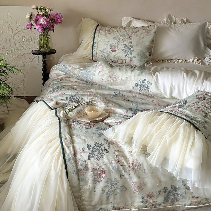 Satin bedding set with ruffled bed skirt and vintage toile print