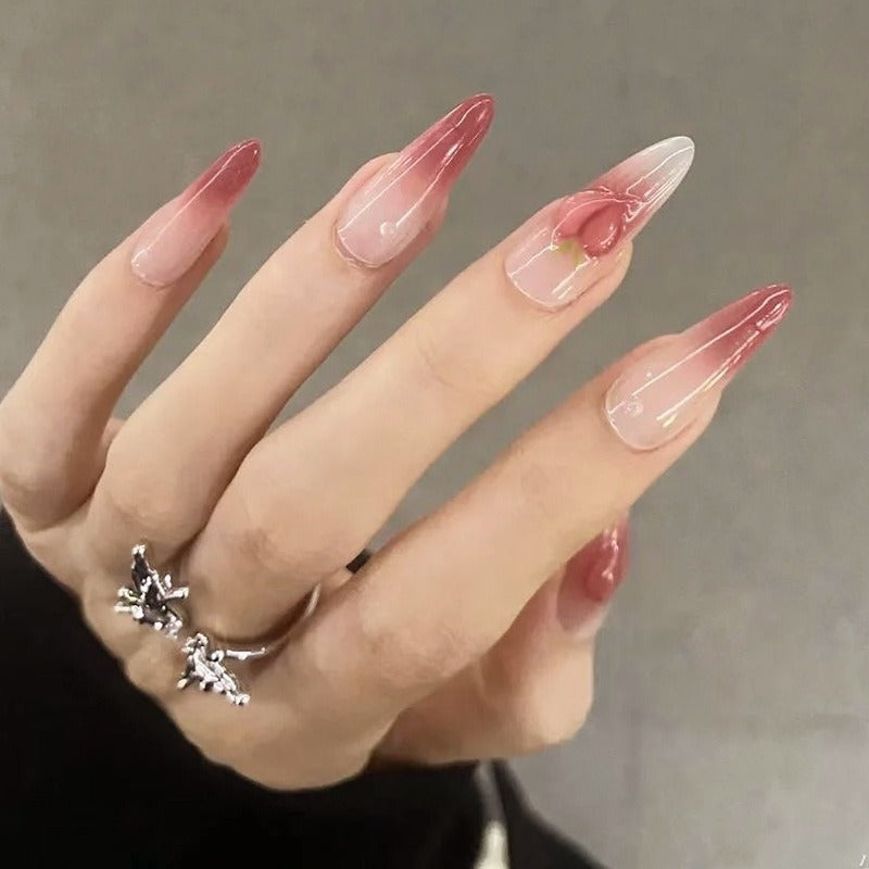 Nail set in elegant ombre design with artistic accents Kalsten