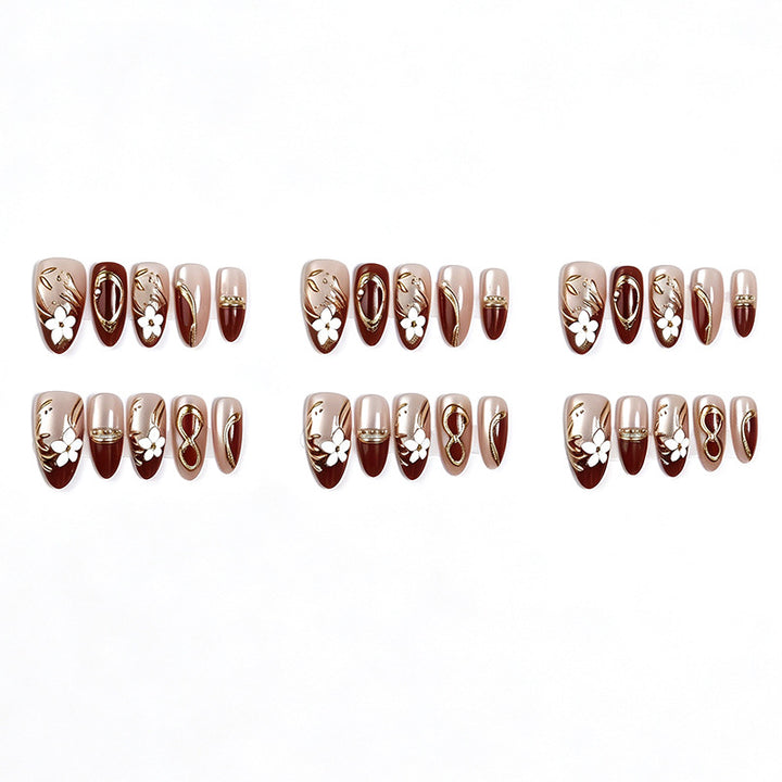 Artificial nail set with floral and glamorous gold embellishments Kalsten