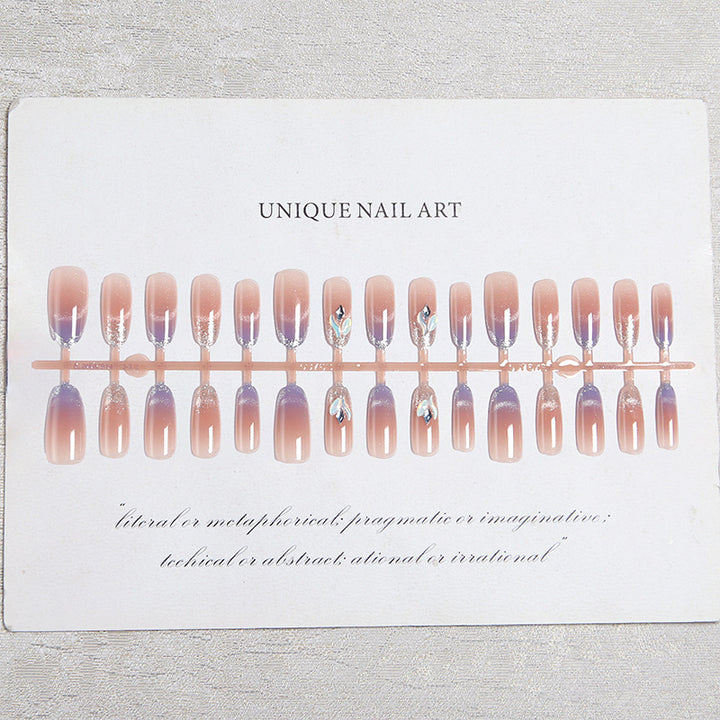 Acrylic nail set with elegant glitter effect and beautified embellishments Kalsten