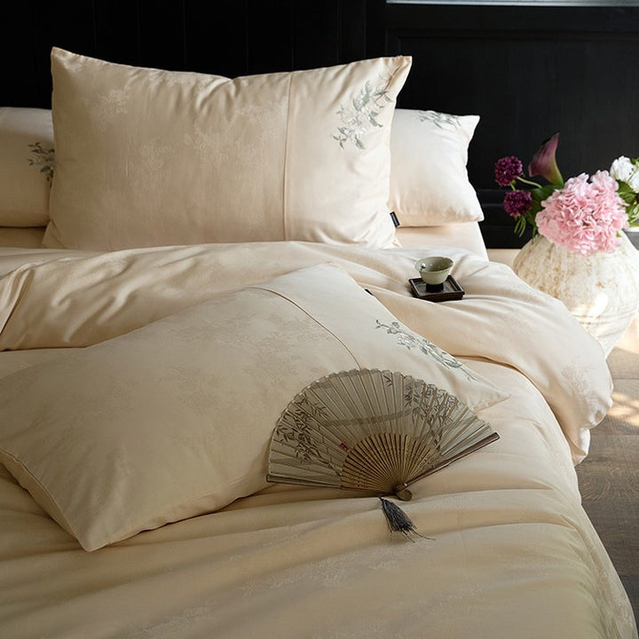 Luxurious satin bedding set with delicate floral embroidery