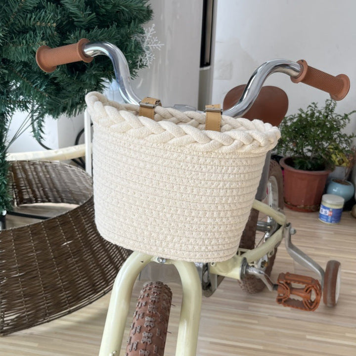 braided rope bike basket with pom pom embellishments and leather handlebar straps Kalsten