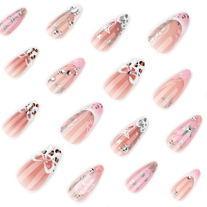 Artful stiletto nails with glitter and bow decorations Kalsten