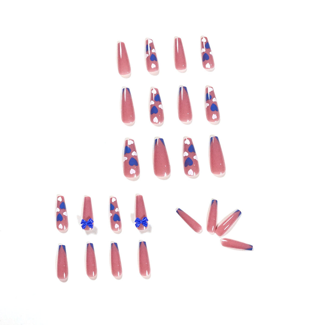 Artful stiletto nails with modern heart and bow motifs Kalsten