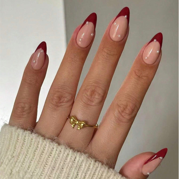 Acrylic nail set with elegant spike design and shimmering accents Kalsten