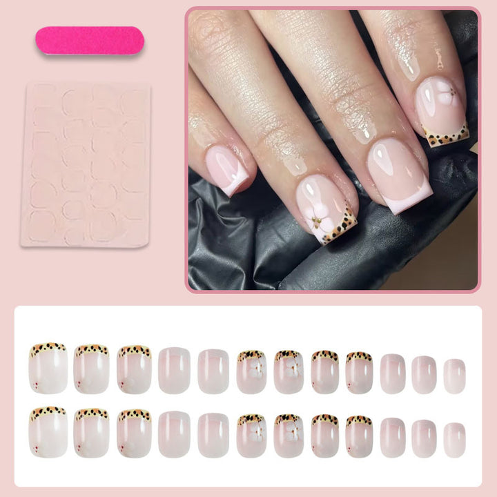Artificial nail set with elegant French tip and floral accent Kalsten
