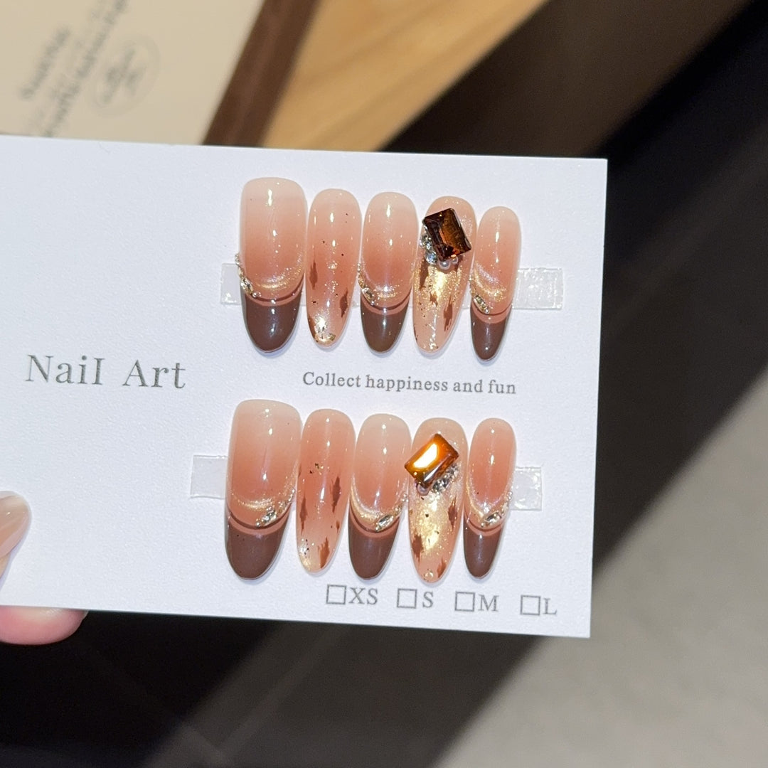 Artificial nails with elegant glitter and gold accent design Kalsten