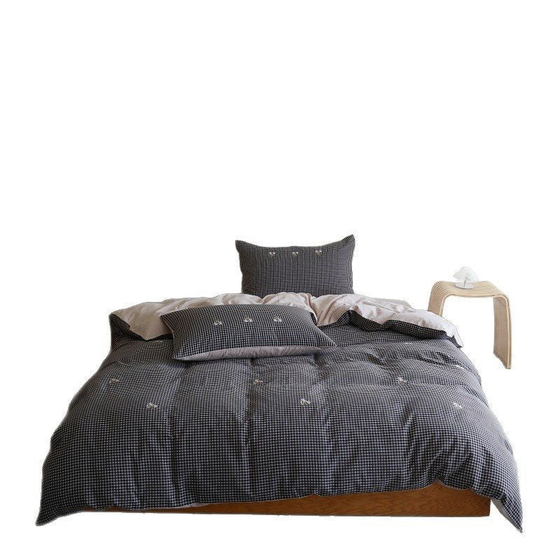 Cotton bedding set with fine check pattern, black reversible side and embroidered heart accents