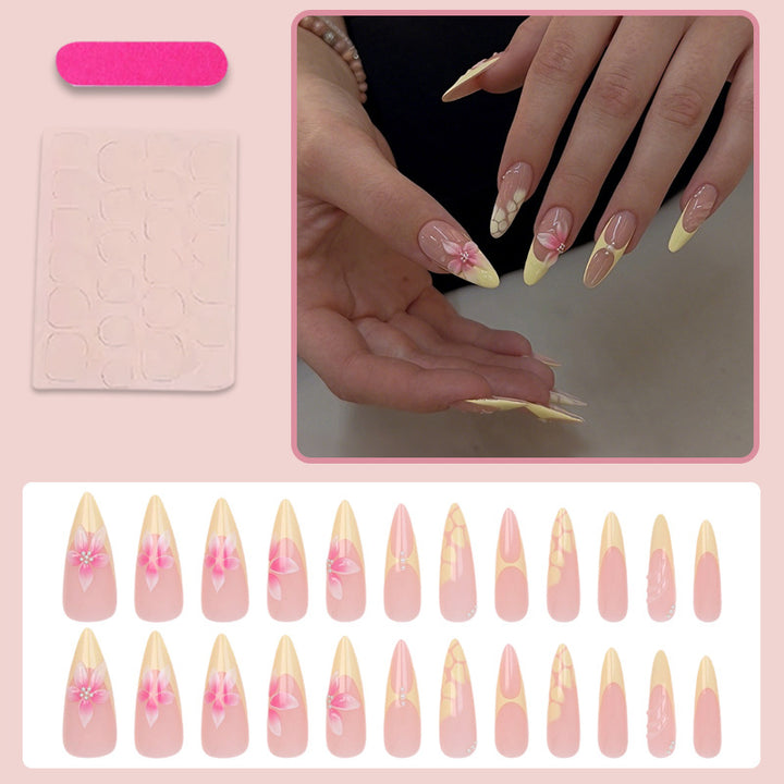 Acrylic nail set with elegant floral pattern and shimmering accents Kalsten