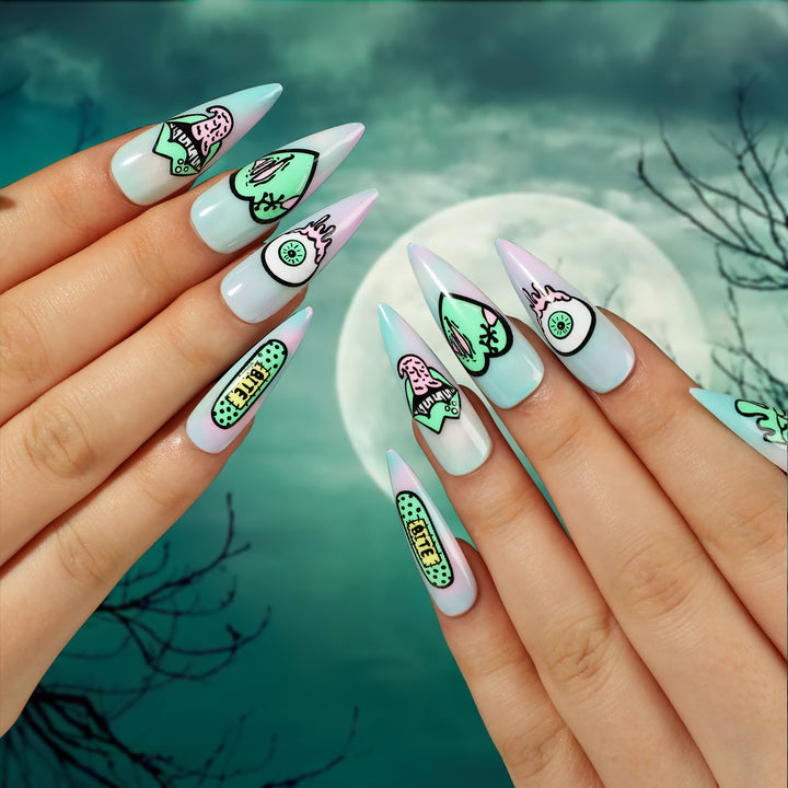 Artistic stiletto nails with creative designs and intricate detailing Kalsten
