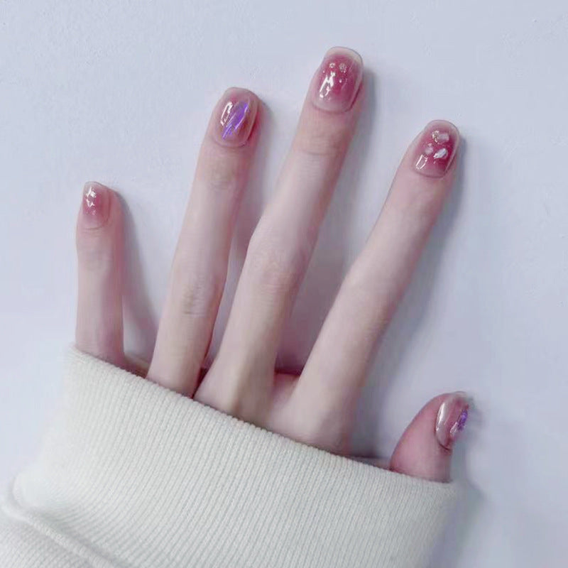 Artificial nails with delicate glitter design and floral accent Kalsten