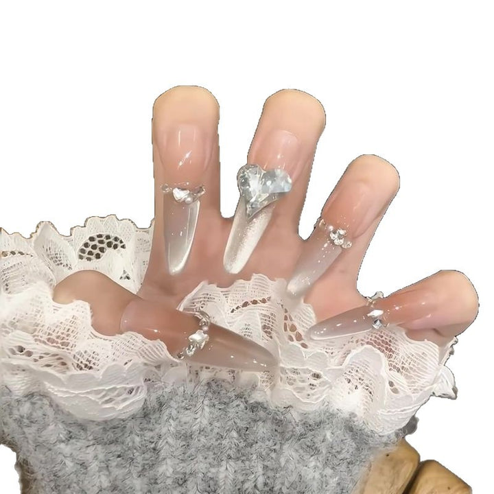 Acrylic nail set with elegant tips and glamorous rhinestone accents Kalsten