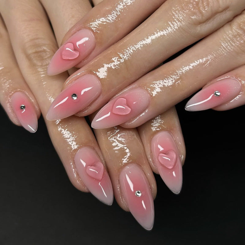 Artful stiletto nails with heart design and glitter accents Kalsten