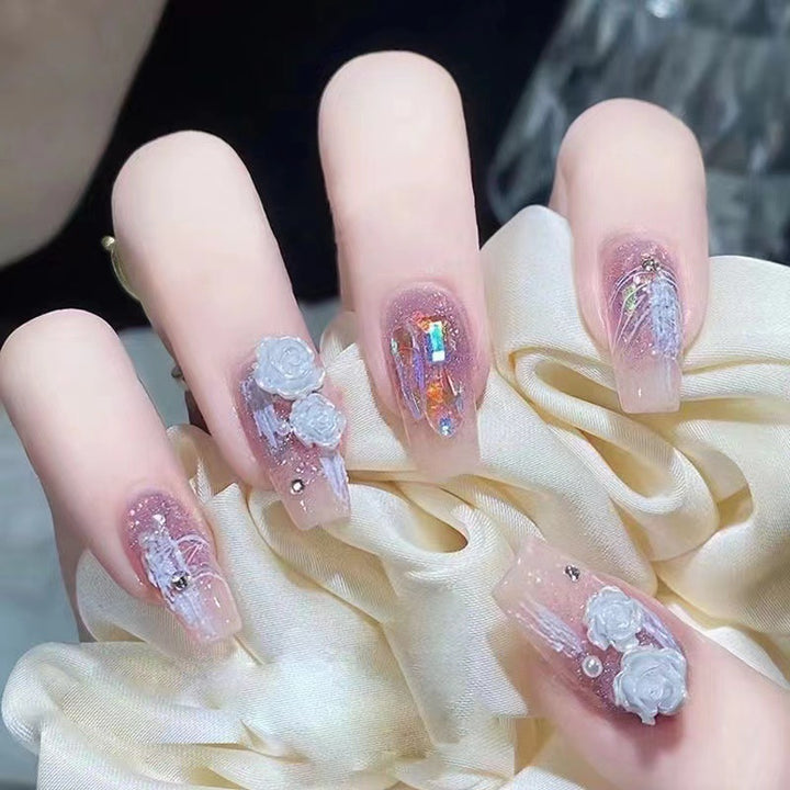 Artistic nail art with floral embellishments Kalsten
