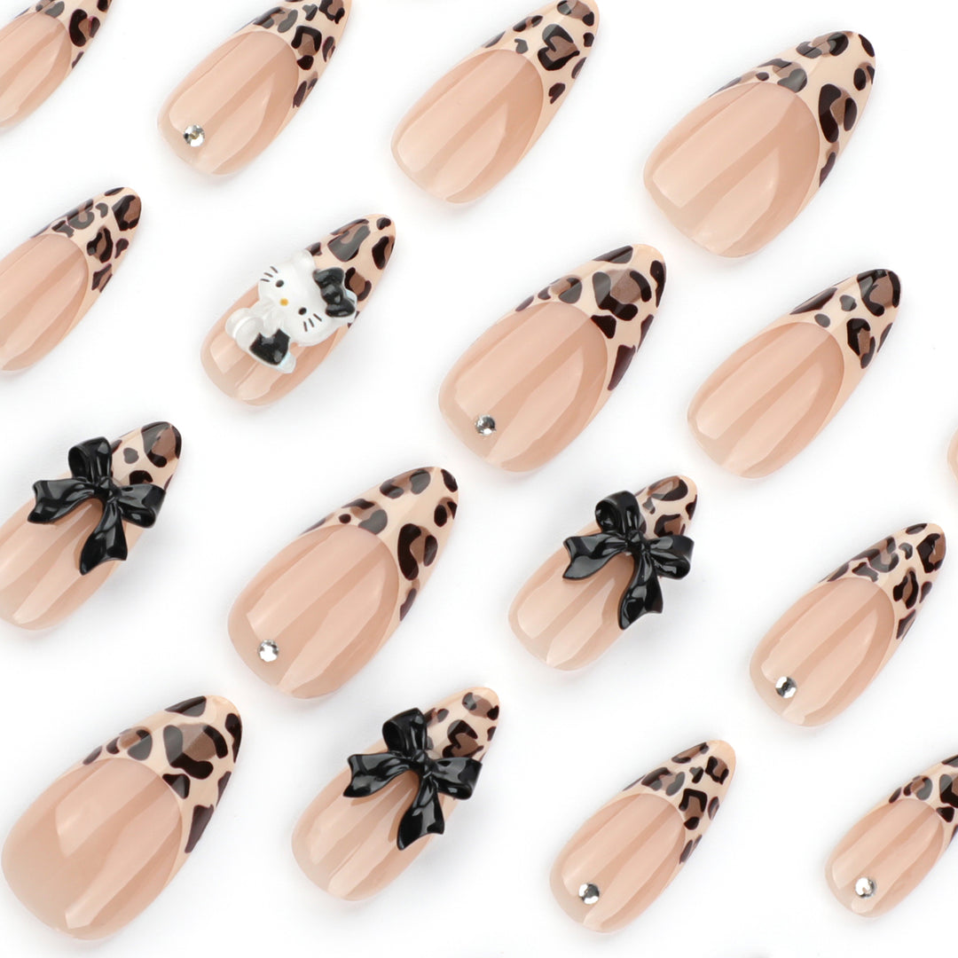Artistic extension nails in leopard pattern with bow accents Kalsten