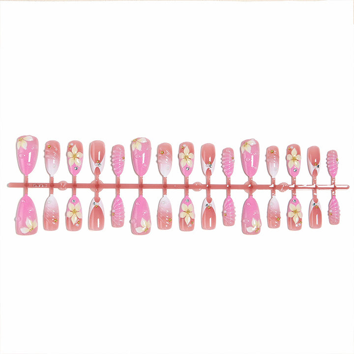 Nail art set with filigree flower patterns and sparkling accents Kalsten