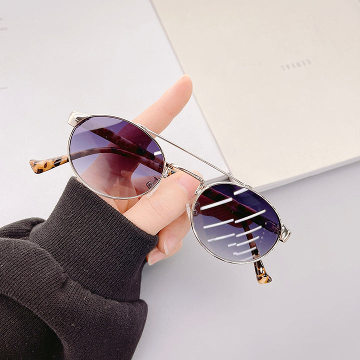 Ladies fashionable sunglasses in stylish round design with golden accents Kalsten