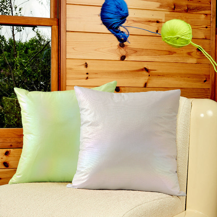 Square decorative cushion with delicate mother-of-pearl look and fine micro tuft structure