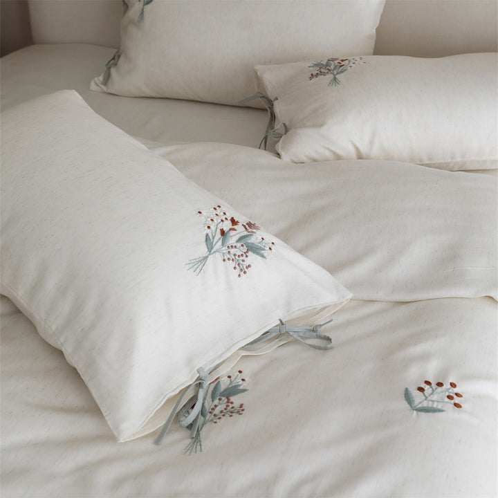Embroidered cotton bedding set with bow pillowcases and dried flower embroidery
