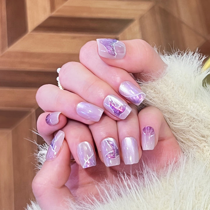 Artfully designed nail extensions with elegant flower motifs Kalsten