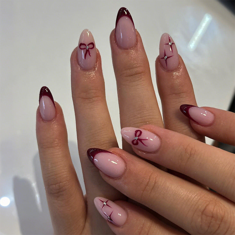 Creative artificial nail set with elegant bow and gradient design Kalsten