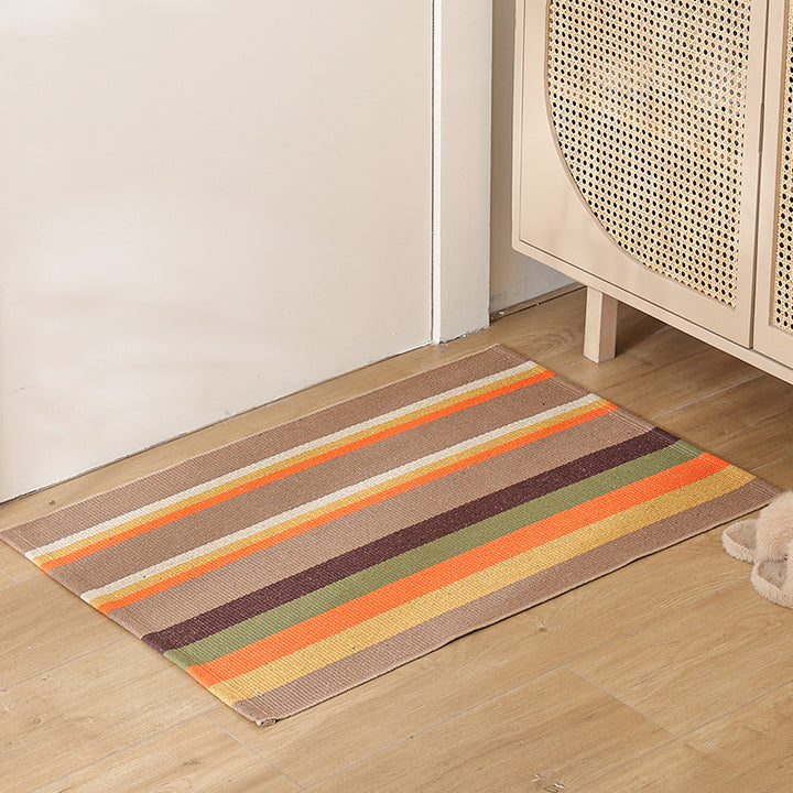 Striped cotton doormat with non-slip bottom and decorative woven edge Kalsten