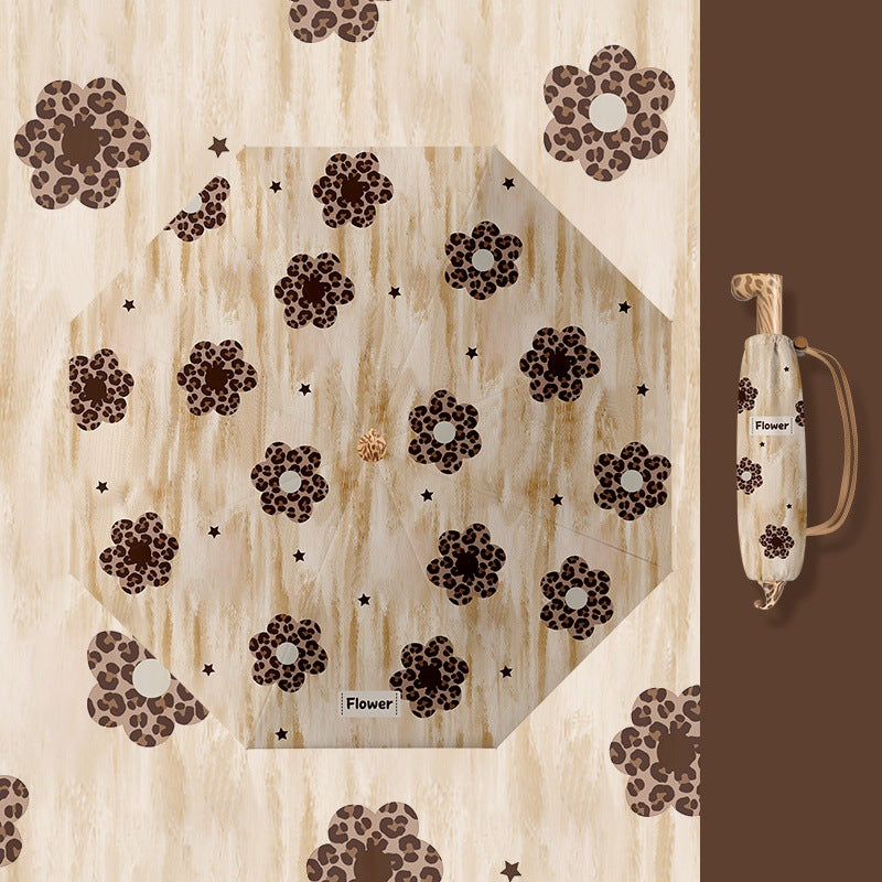 Ladies folding umbrella with playful design Kalsten