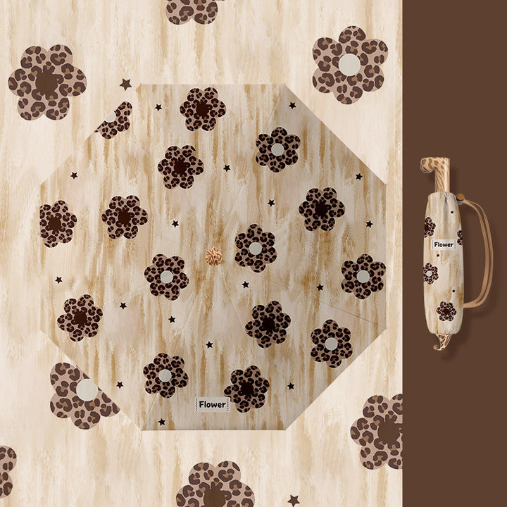 Ladies folding umbrella with playful design Kalsten