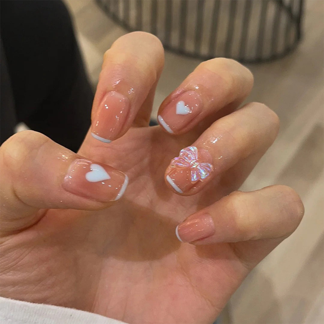 Nail art with heart and butterfly motifs Kalsten