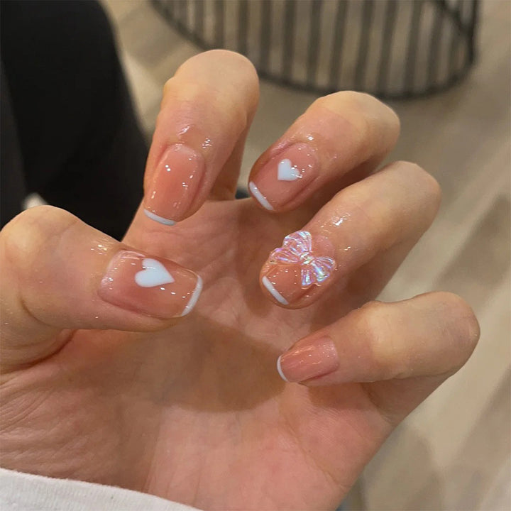 Nail art with heart and butterfly motifs Kalsten