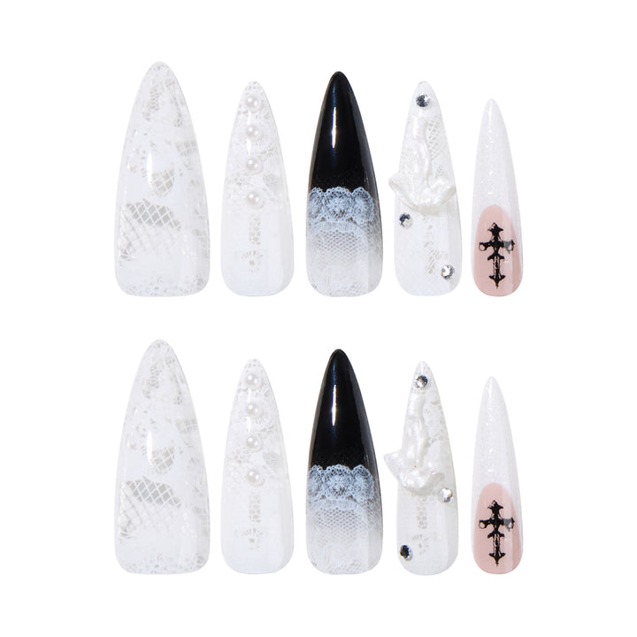 Artful stiletto nails with unique 3D elements and glitter accents Kalsten