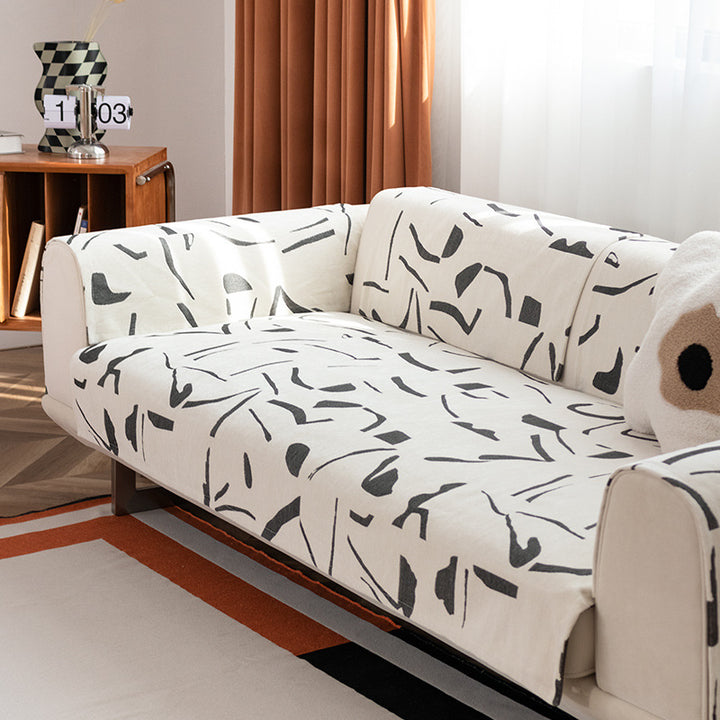 Stretch sofa cover with abstract brushstroke print and elastic waistband Kalsten