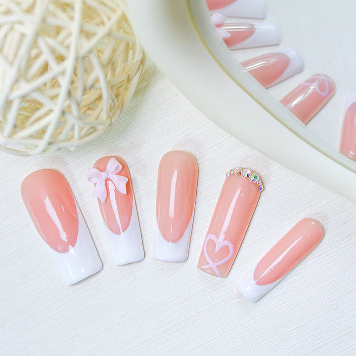 Artifical nail set with playful bow and heart designs Kalsten