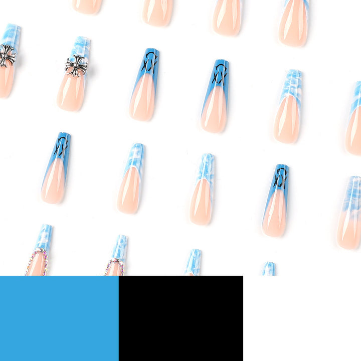 Artistic acrylic nails with marbled design and unique embellishments Kalsten