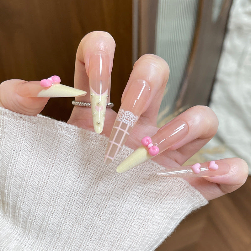 Artistic Press-On Nail Design with Cute Bow Accents Kalsten