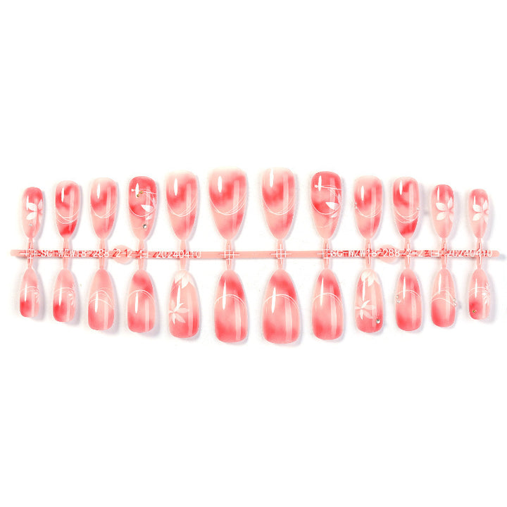 Acrylic nail set with elegant ombre design and floral accent Kalsten