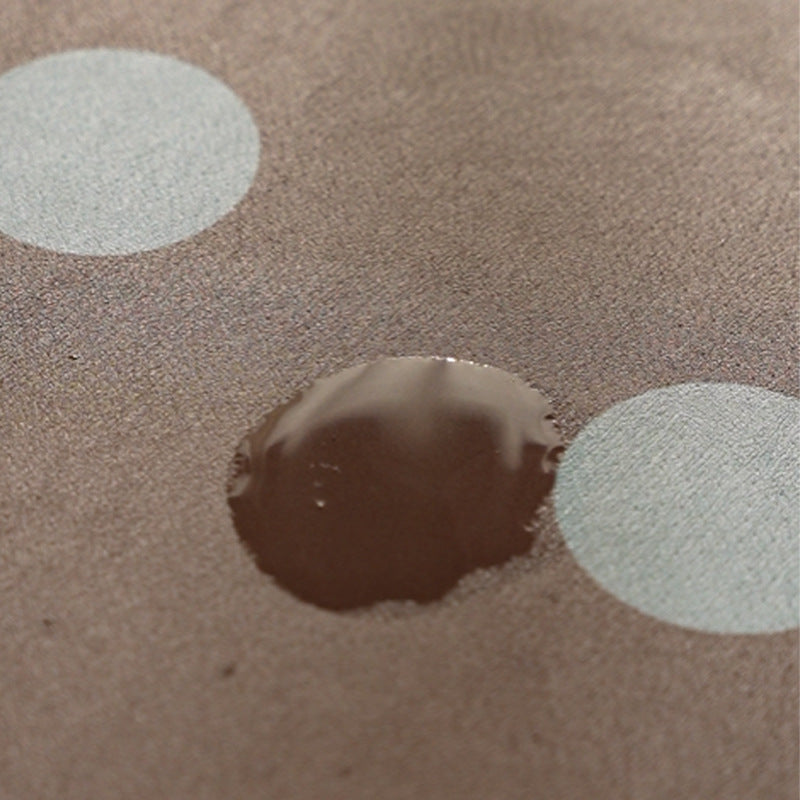 Wipeable placemat made of PVC with large polka dot pattern and non-slip backing Kalsten