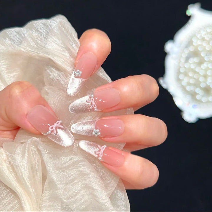 Artificial nail set with elegant bow and rhinestone embellishments Kalsten