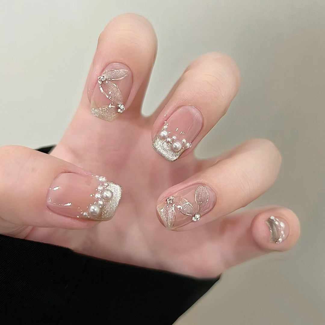 Elegant artificial nails with pearl decorations and glitter effects Kalsten