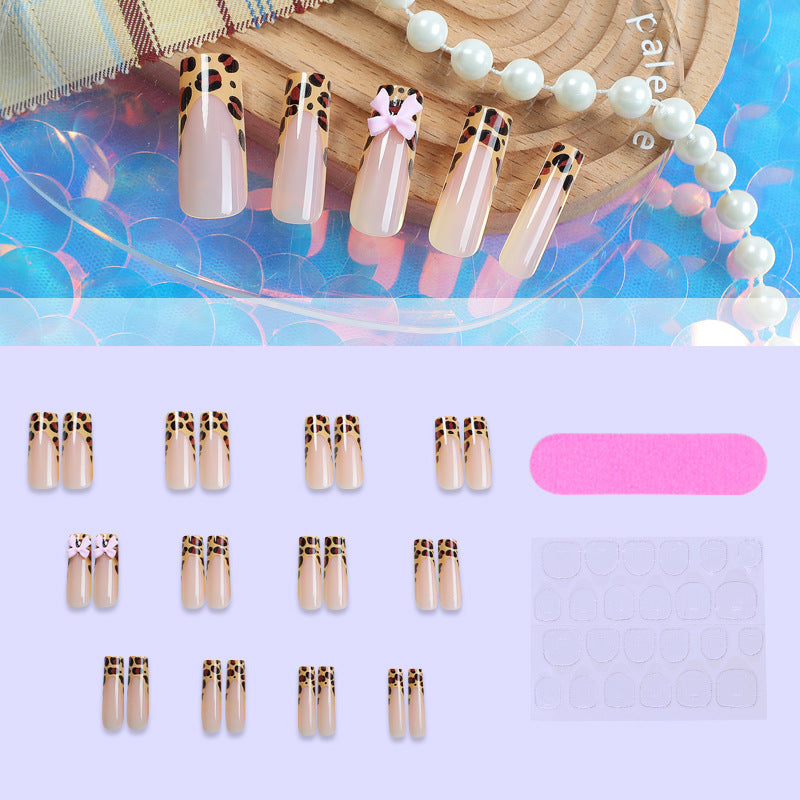 Decorative Stiletto Press-On Nail Art with Animal Print and Bow Accents kalsten