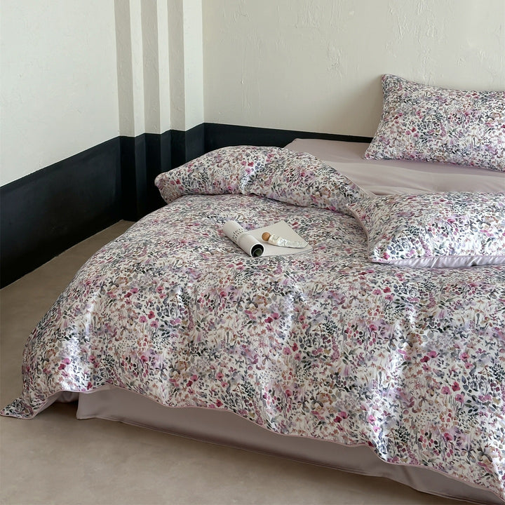 Luxurious satin bedding set with floral watercolor print, ruffled edges and reversible function