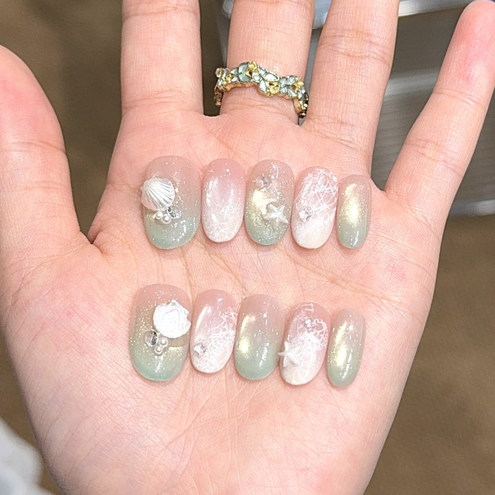 Artificial nail tips with maritime design and glitter effects Kalsten
